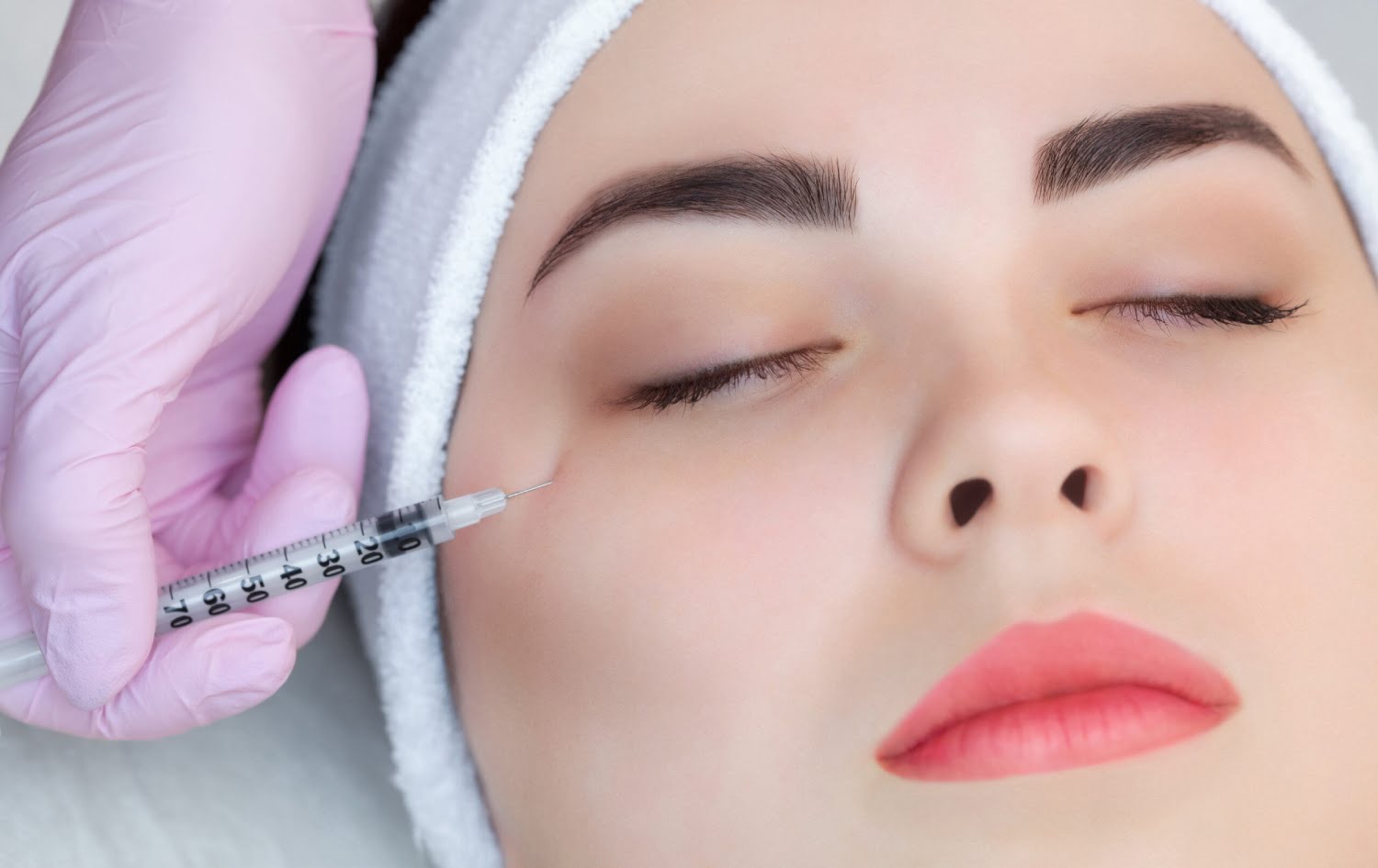 The doctor cosmetologist makes the Botulinum Toxin injection pro