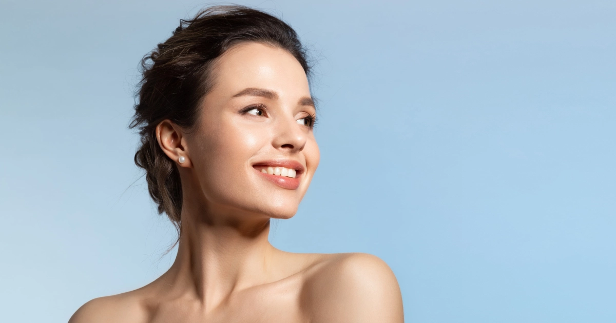 Woman with smooth, glowing skin after Sculptra treatment in Denver, CO